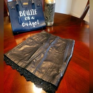 Black leather mini skirt with a hint of sequins and lace underneath. 6/8